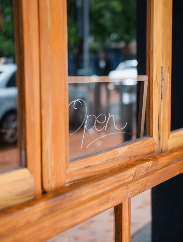 open-text-on-glass-window-of-side-walk-cafe-2021-08-28-16-44-56-utc